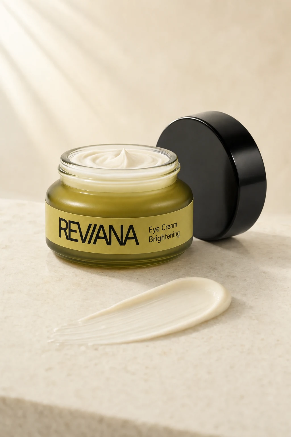 Open Reviana Eye Cream jar with a pearl-white cream swipe