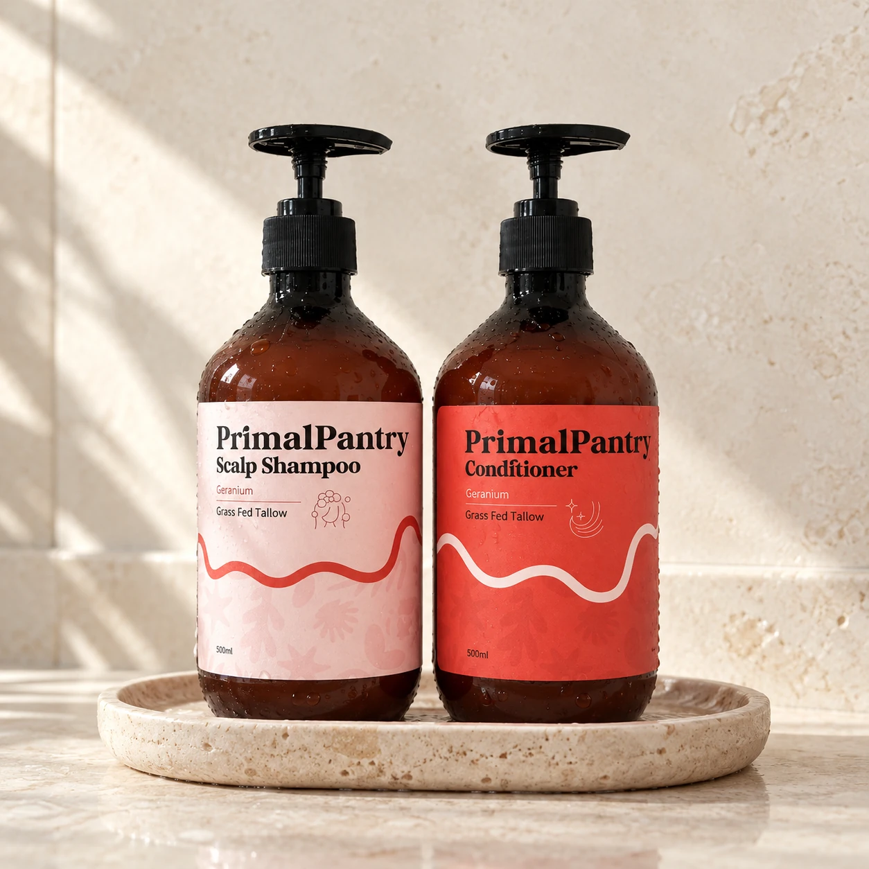 Matching 500ml shampoo and conditioner together on a shared stone tray