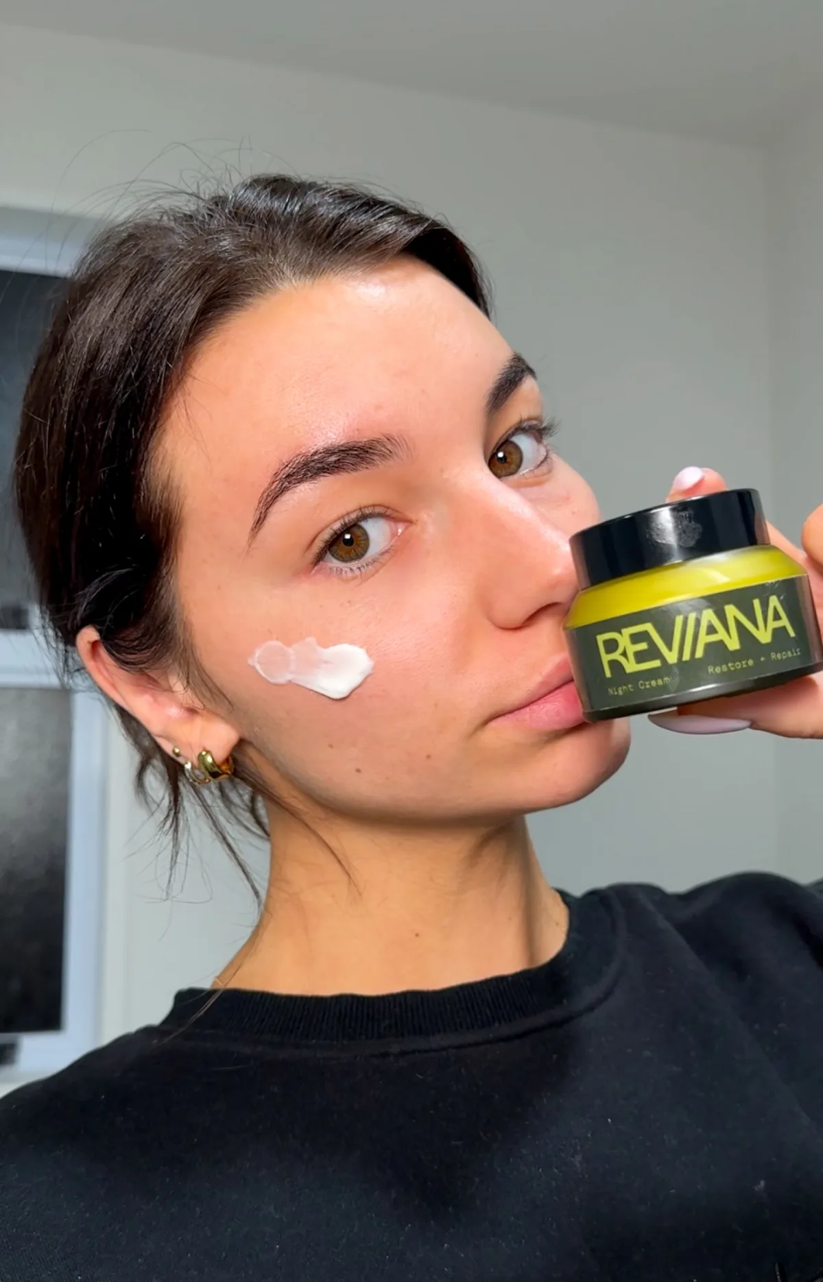 Applying the Reviana Night Cream before bed