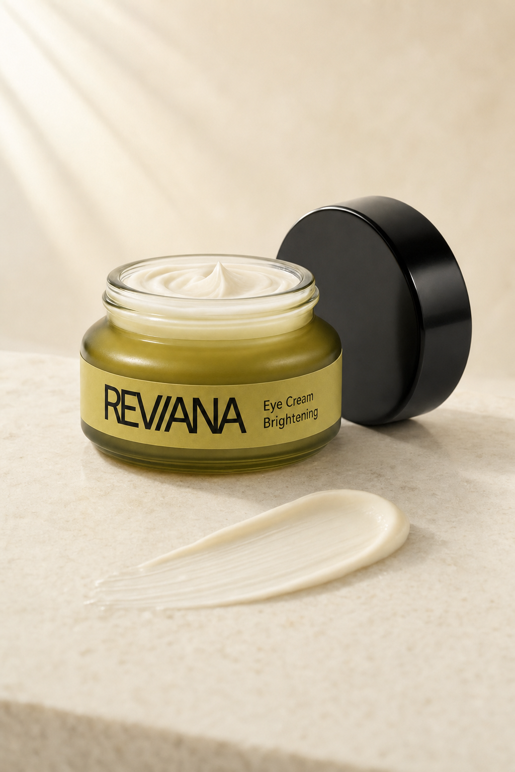 The open jar with a light swipe of pearl-white cream